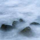 USA, New Jersey, Cape May National Seashore. Boulders on ocean shore. Art Print